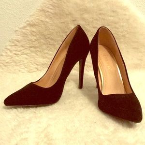 Black suede point toe pumps